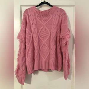 Pink cable knit sweater with fringe sleeves